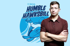 Brian Gerkey with ROS Humble Hawksbill logo behind him