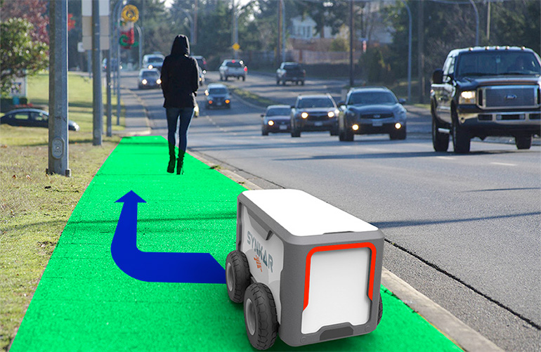 A synkar mobile robot navigates on the sidewalk