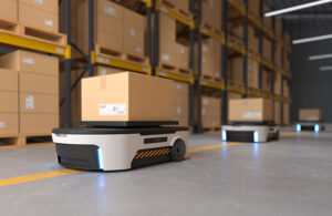 a mobile robot carries a box through a warehouse.